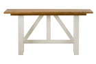 Wooden table with white legs on a white background